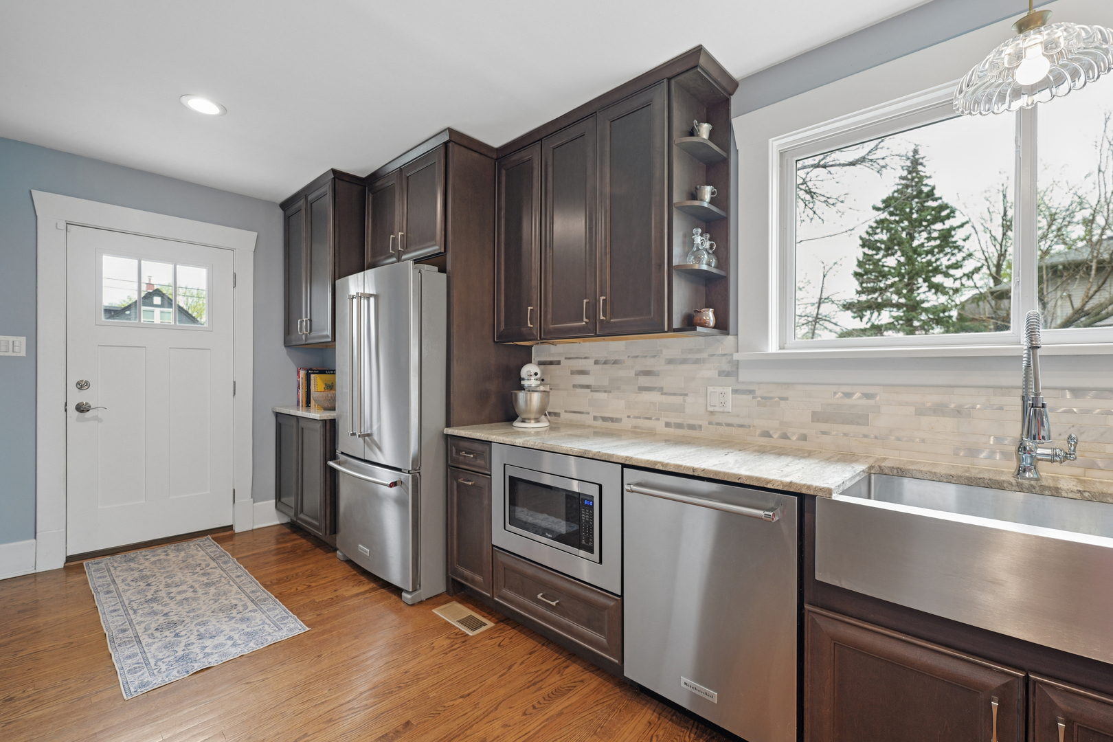 4136 Raymond Avenue Brookfield, IL 60513 - Photo 9 of 23 a kitchen with stainless steel appliances granite countertop a refrigerator and a sink