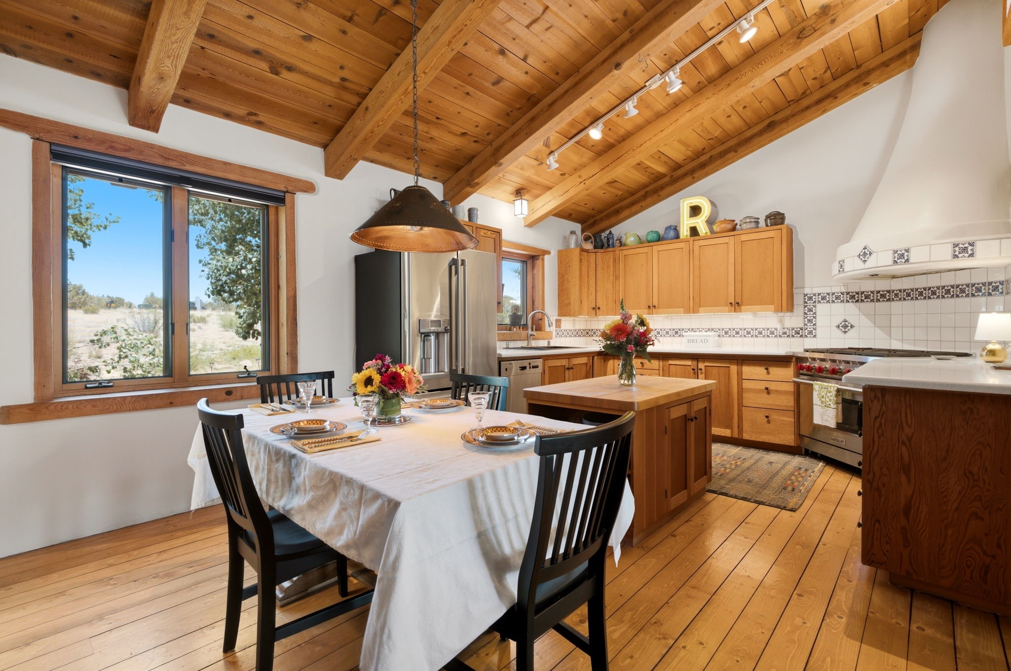 22 Mimosa Road Santa Fe, NM 87508 - Photo 8 of 51 Stainless appliances, dining area and real wood floors