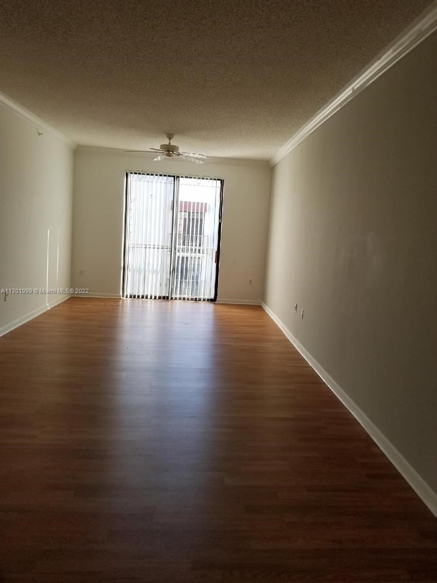 Parkside Hollywood, FL 33020 - Photo 14 of 26 a view of an empty room with wooden floor and a window