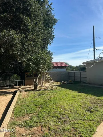a backyard of a house with lots of green space
