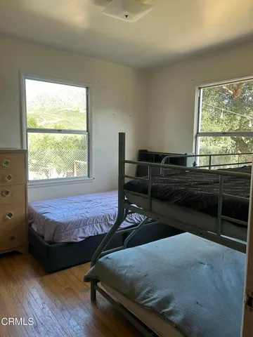 a bedroom with furniture and a window