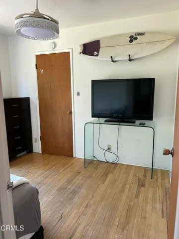 a view of a livingroom with furniture and wooden floor