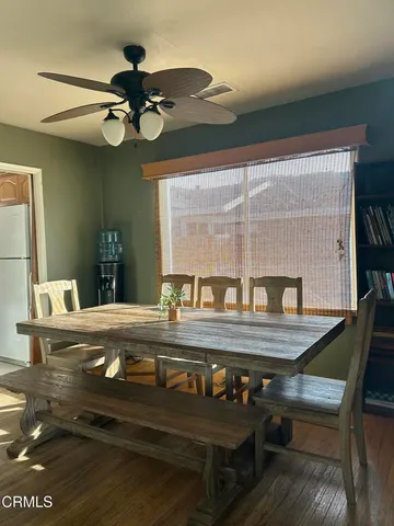 a view of dining room and wooden floor