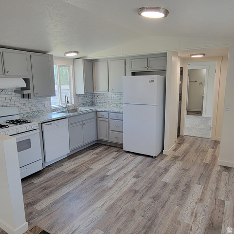 1735 South 1380 West Logan, UT 84321 - Photo 14 of 46 Kitchen featuring white appliances, a stainless steel sink, light grey cabinetry, patterned countertops, and a white subway tile backsplash