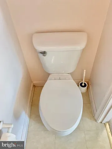 a bathroom with a toilet and a sink