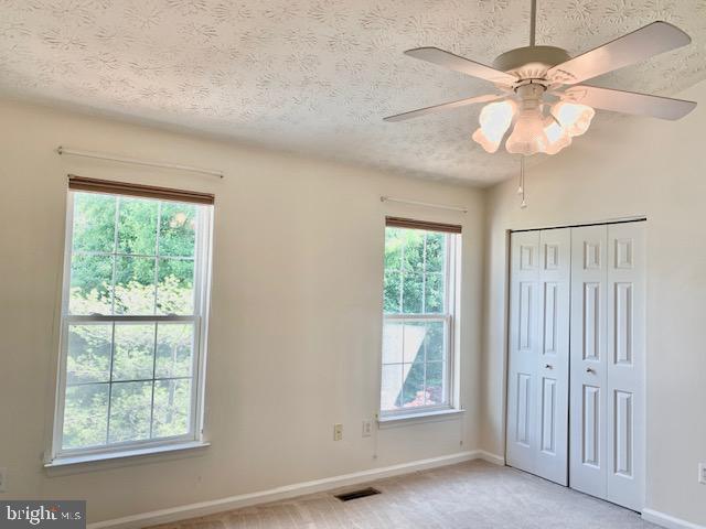 3207 Water Lily Court Laurel, MD 20724 - Photo 18 of 39 an empty room with windows and fan