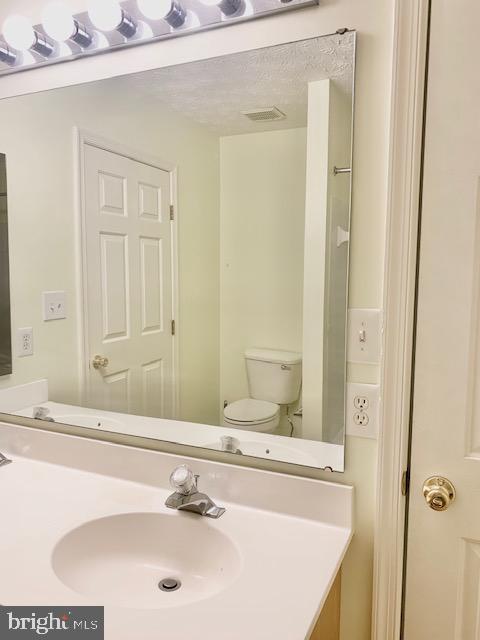 3207 Water Lily Court Laurel, MD 20724 - Photo 22 of 39 a bathroom with a sink and a mirror