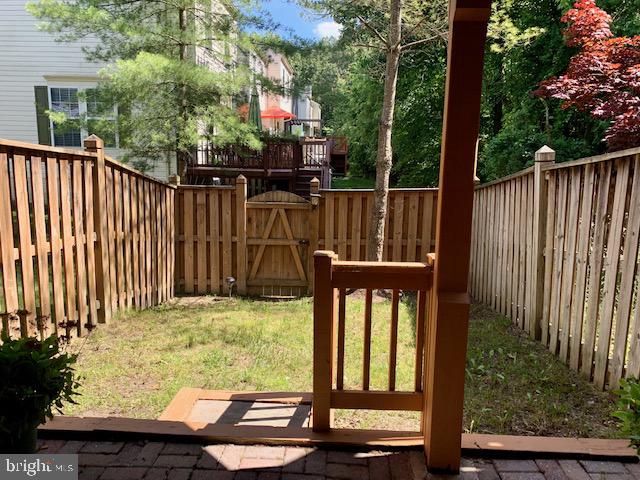 3207 Water Lily Court Laurel, MD 20724 - Photo 36 of 39 a view of a wooden door with a bench