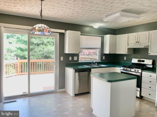 3207 Water Lily Court Laurel, MD 20724 - Photo 5 of 39 a kitchen with granite countertop a sink a counter top space and stainless steel appliances