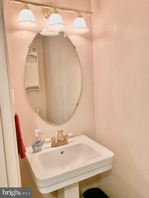 3207 Water Lily Court Laurel, MD 20724 - Photo 10 of 39 a bathroom with a sink and a mirror