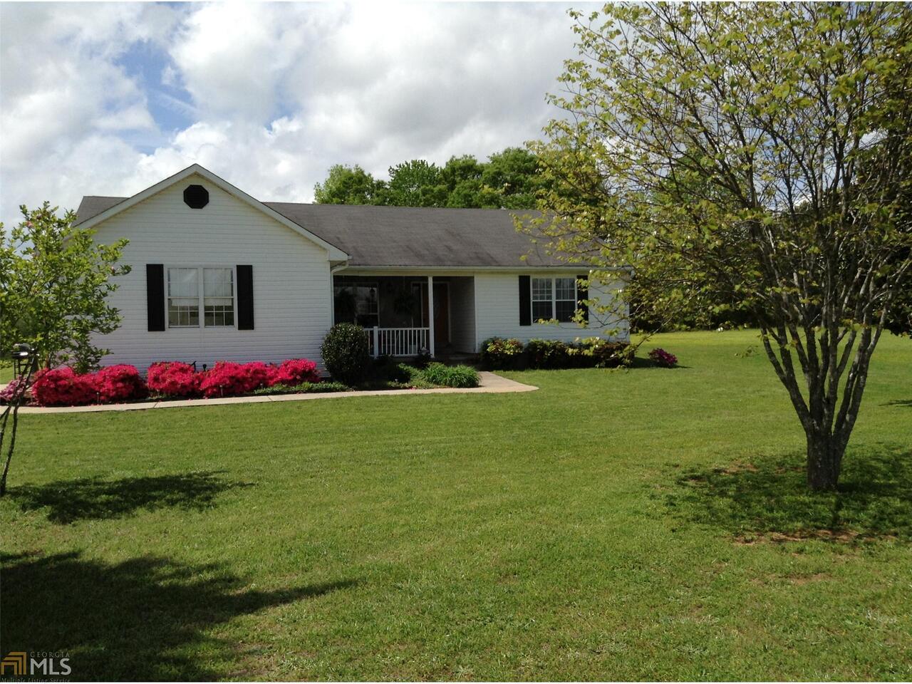 2460 Luella Road Locust Grove, GA 30248 - Photo 1 of 1 a front view of house with yard and green space
