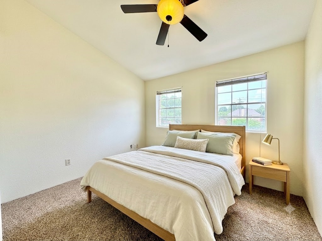 2002 Gentryside Drive, Unit 103 Houston, TX 77077 - Photo 13 of 20 Primary bedroom upstairs, virtually staged
