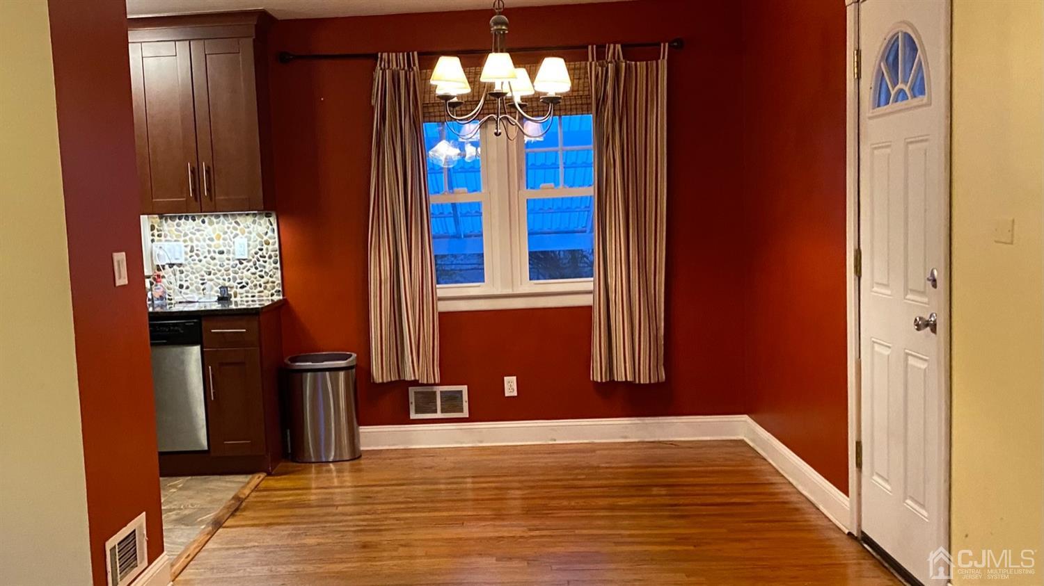 1 Terrill Road Edison, NJ 08817 - Photo 8 of 19 a view of a livingroom with furniture cabinet and window