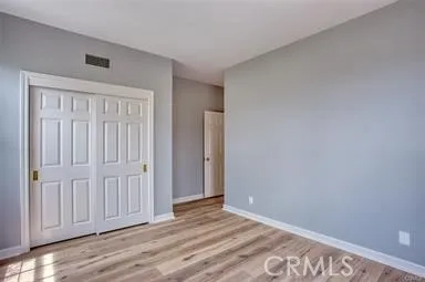 an empty room with wooden floor