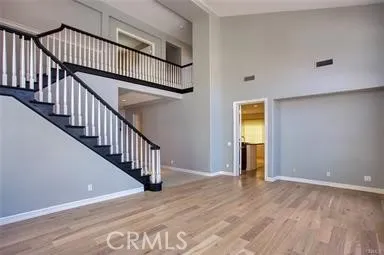 a view of an entryway with wooden floor