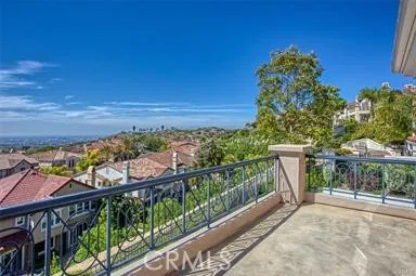 a view of a balcony with wooden floor and outdoor space