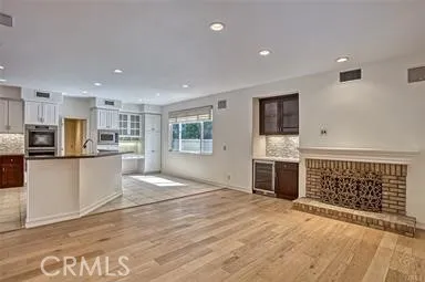 a view of kitchen with furniture and refrigerator
