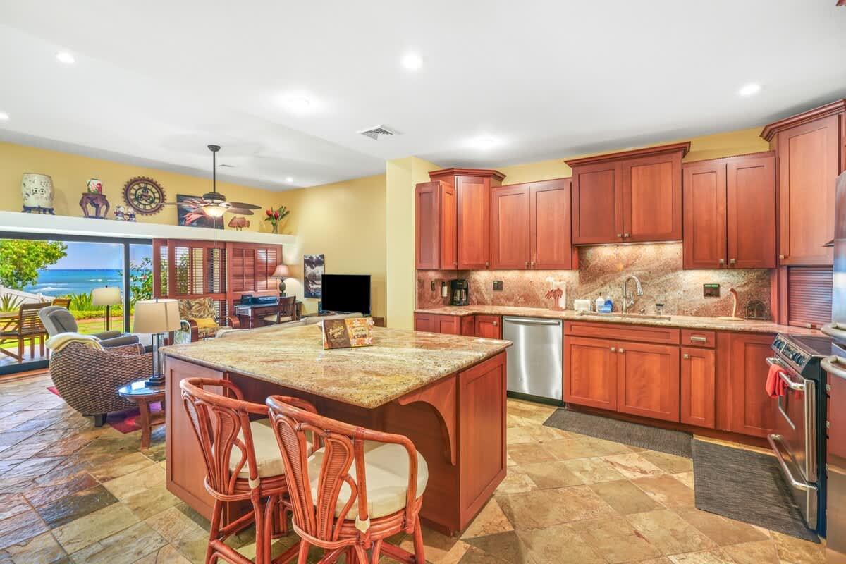366 Papaloa Road, Unit 114 Kapaa, HI 96746 - Photo 11 of 23 a kitchen with stainless steel appliances granite countertop a sink and cabinets