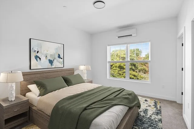 a bedroom with bed and a window