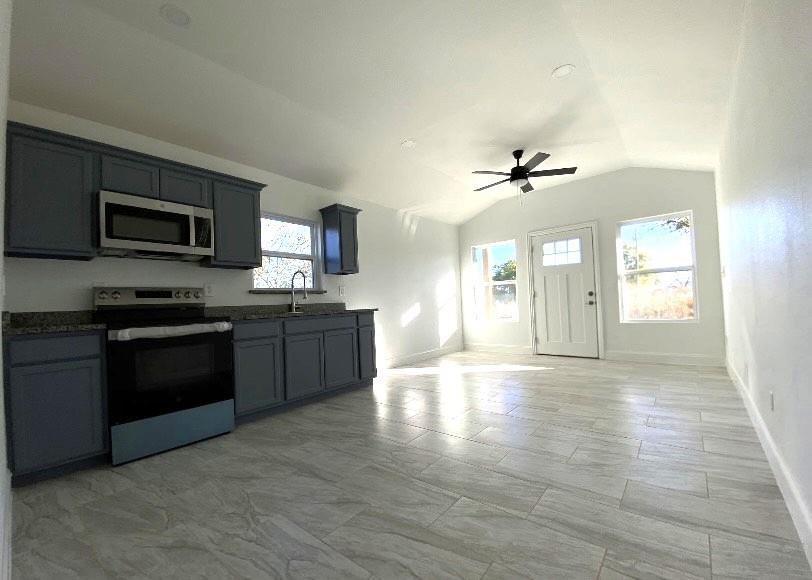 119 Ringo Drive Bridgeport, TX 76426 - Photo 3 of 10 a view of kitchen with sink a microwave and cabinets