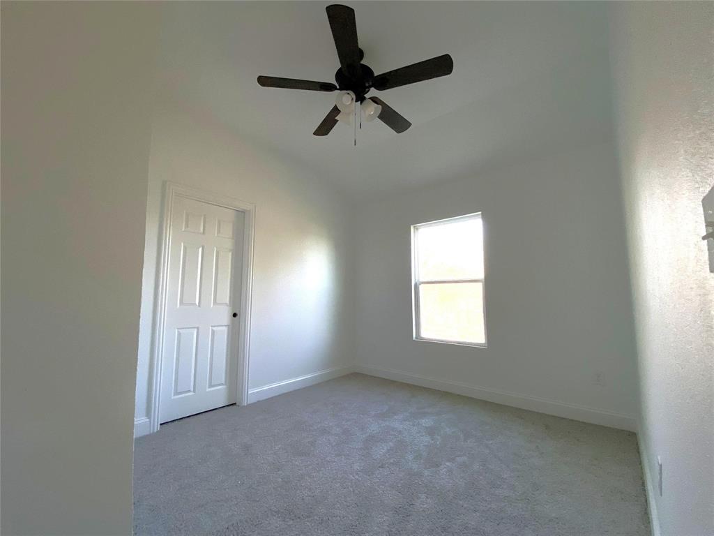 119 Ringo Drive Bridgeport, TX 76426 - Photo 5 of 10 a view of empty room with windows