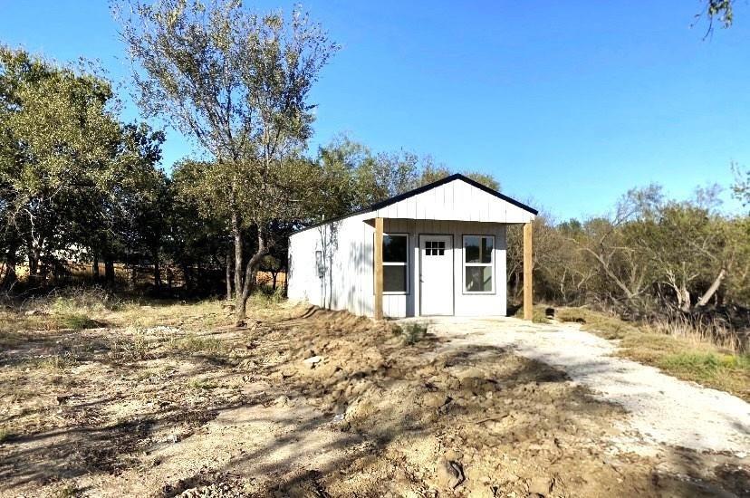 119 Ringo Drive Bridgeport, TX 76426 - Photo 10 of 10 a front view of a house with a yard