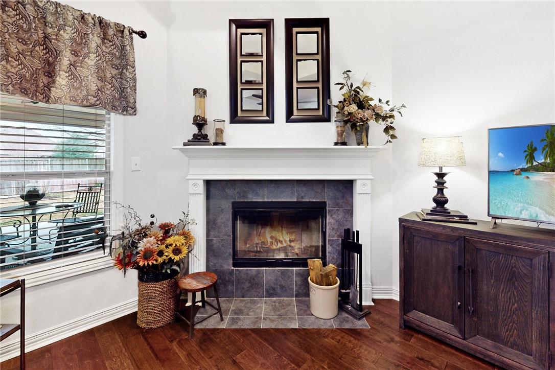 3317 Fiddlers Green Bryan, TX 77808 - Photo 13 of 36 a living room with furniture and a fireplace