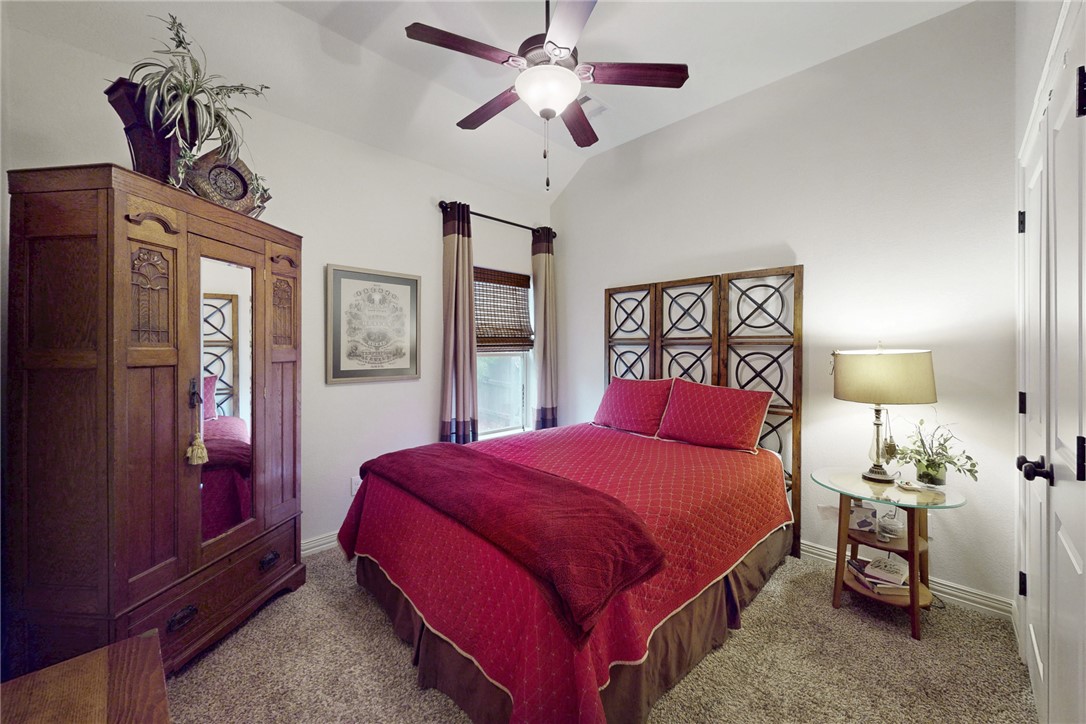 3317 Fiddlers Green Bryan, TX 77808 - Photo 24 of 39 Guest Bedroom with Ceiling Fan with Light Fixture and Carpet Flooring
