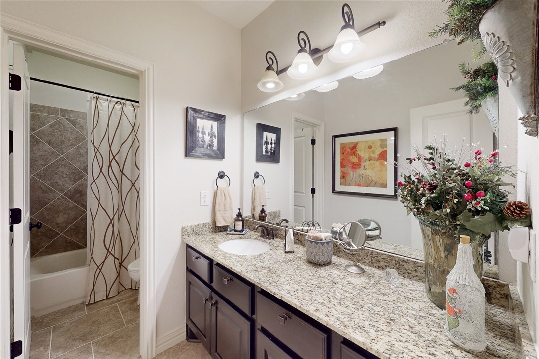 3317 Fiddlers Green Bryan, TX 77808 - Photo 25 of 39 Guest Bathroom with Large Vanity Area with Granite Countertop, Kent Moore Cabinets, Separate Toilet, Tub and Shower Area