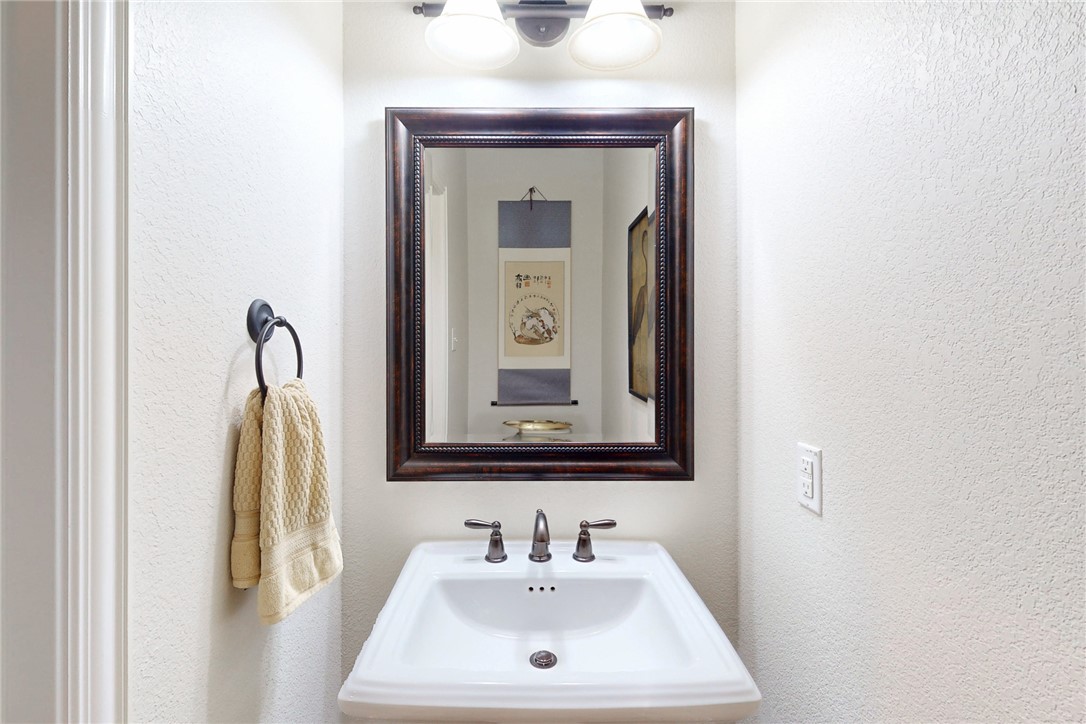 3317 Fiddlers Green Bryan, TX 77808 - Photo 33 of 36 a bathroom with a sink and a mirror