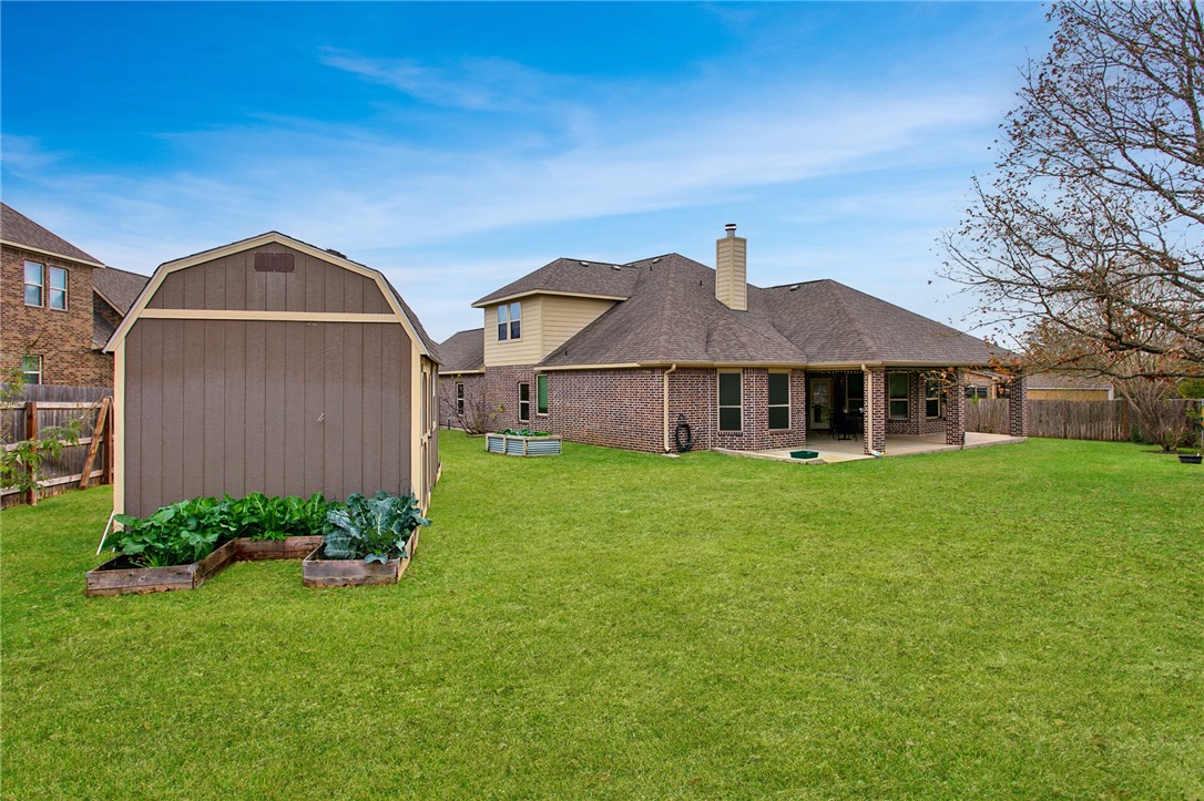 3317 Fiddlers Green Bryan, TX 77808 - Photo 35 of 39 Large Backyard and Storage Building, Raised Vegetable Beds