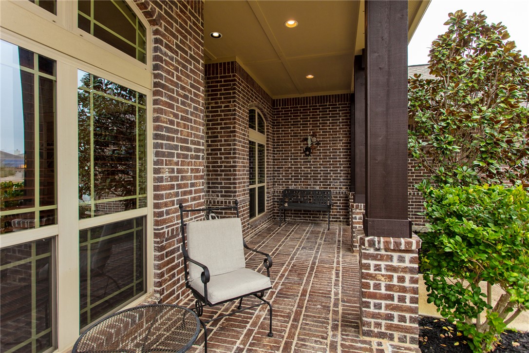 3317 Fiddlers Green Bryan, TX 77808 - Photo 3 of 36 a view of a balcony with chairs and potted plants