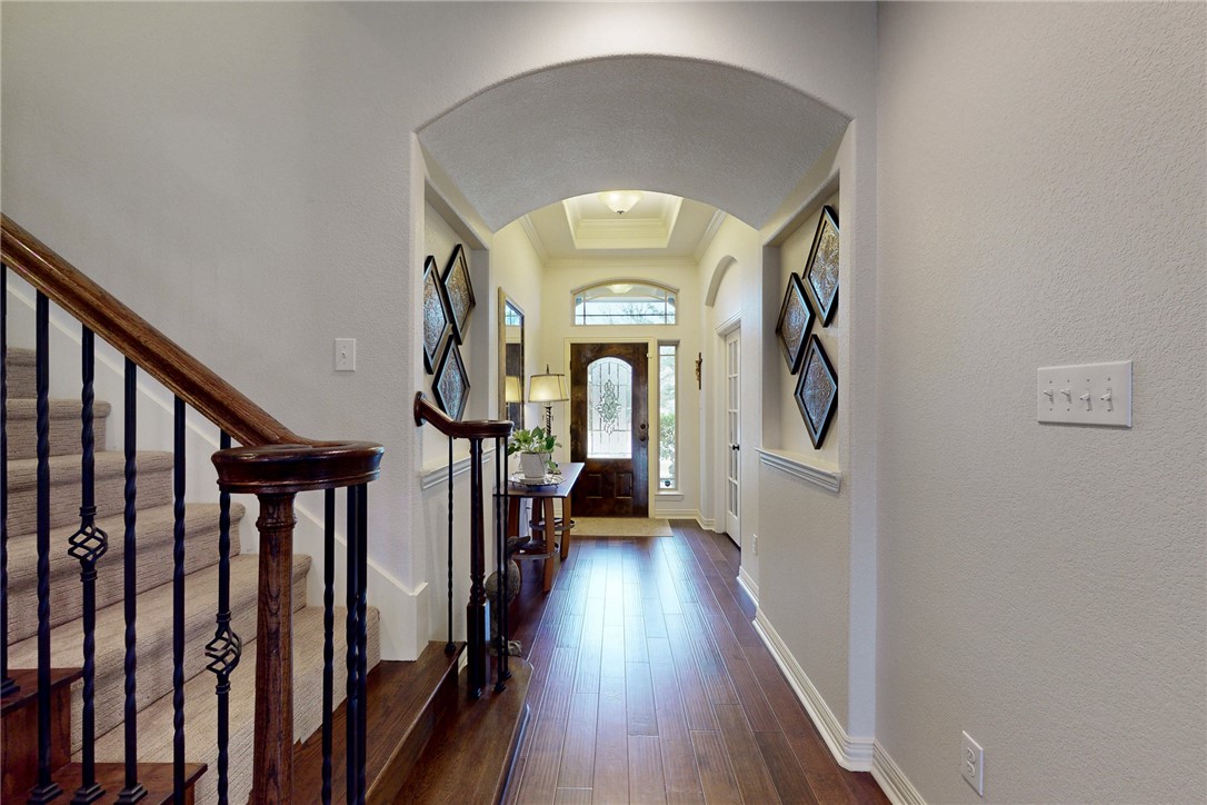 3317 Fiddlers Green Bryan, TX 77808 - Photo 5 of 36 Beautiful wide foyer with Alder Wood Front Door with Etched Glass, Transom Window, Sidelight Window, Gorgeous Architectural Details-Tray Ceiling Hardwood Floor Throughout, Niche