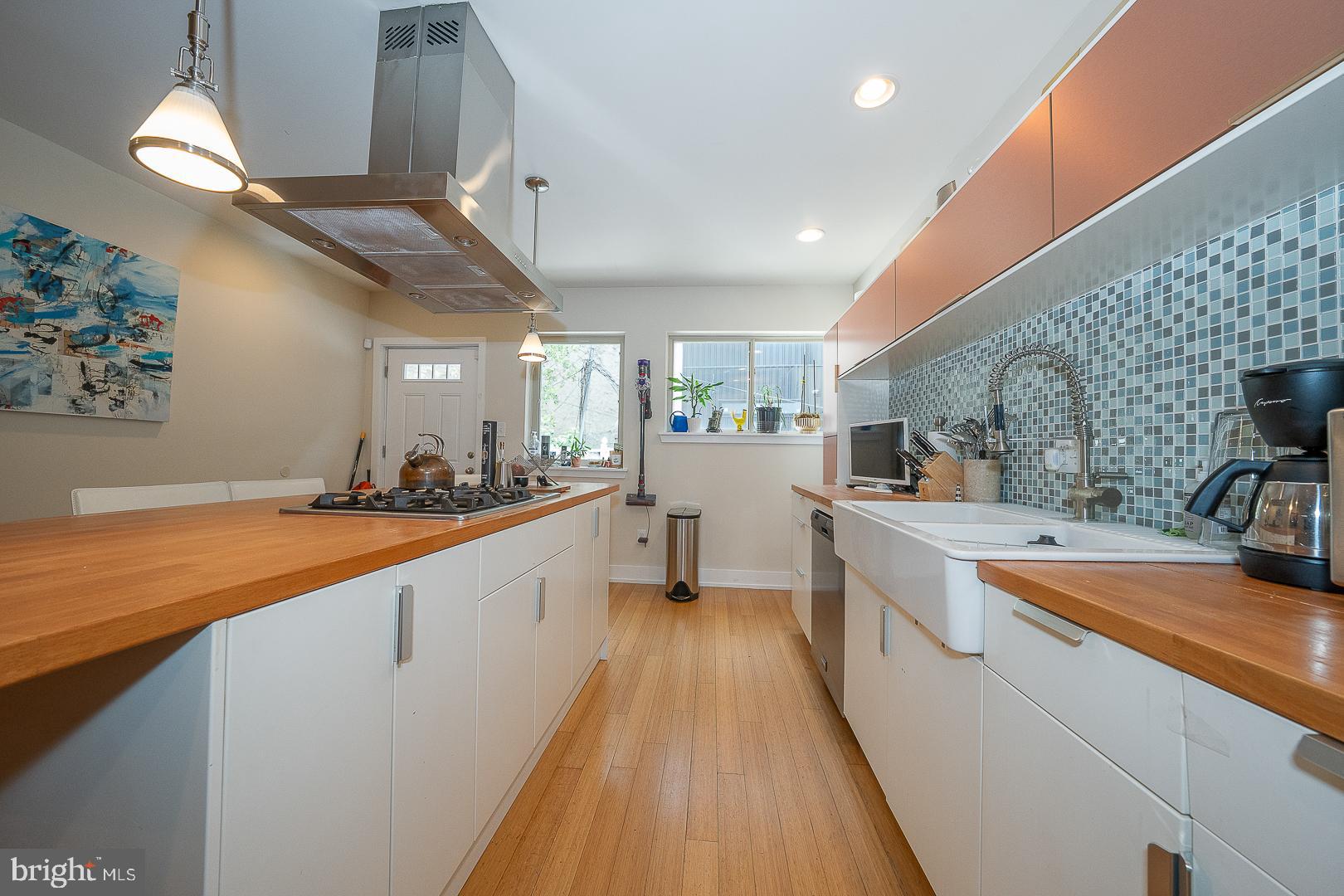 715 Shirley Street, Unit A Philadelphia, PA 19130 - Photo 9 of 24 a large kitchen with stainless steel appliances granite countertop a lot of counter space and wooden floor