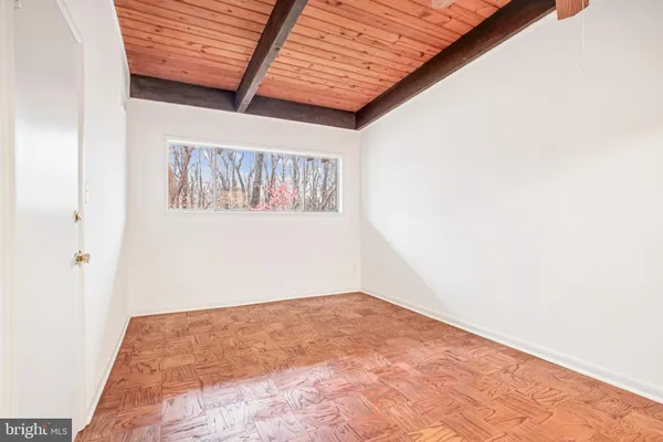 a view of a room with a wooden floor