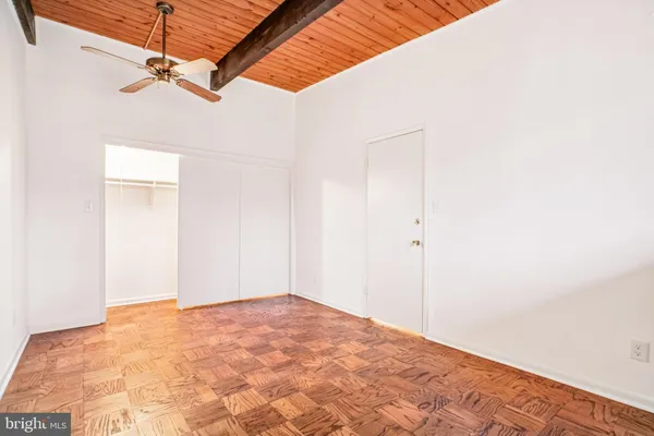 a view of a room with a ceiling fan