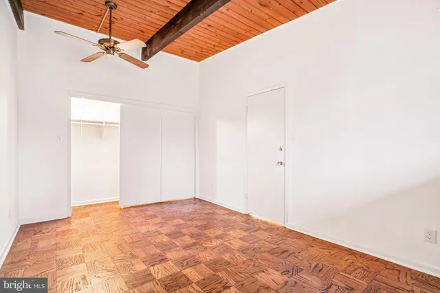 a view of a room with a ceiling fan