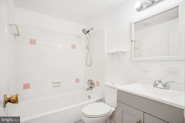 a bathroom with a sink a toilet and a bathtub