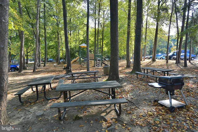 a view of a backyard with sitting area