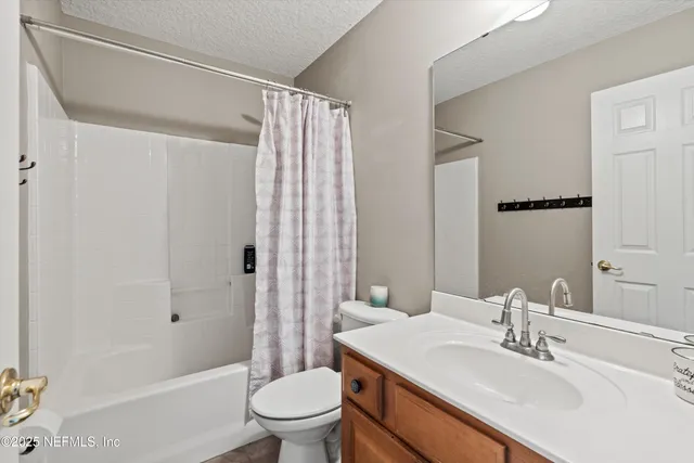 a view of a house with a yard and garage