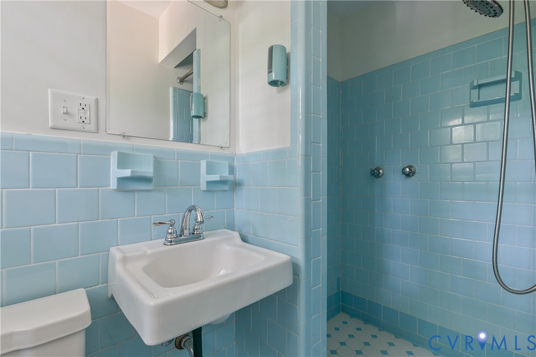 200 Stanmore Road North Chesterfield, VA 23236 - Photo 18 of 37 Light blue ceramic wall tiling with a wall-mounted