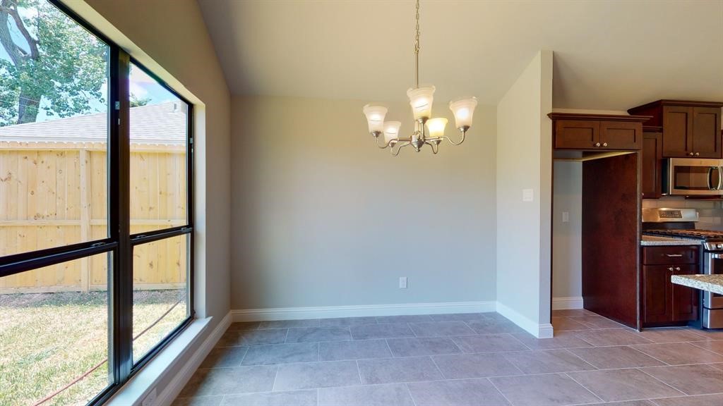 311 Mascot Street Houston, TX 77029 - Photo 11 of 23 a view of a livingroom with furniture wooden floor and window