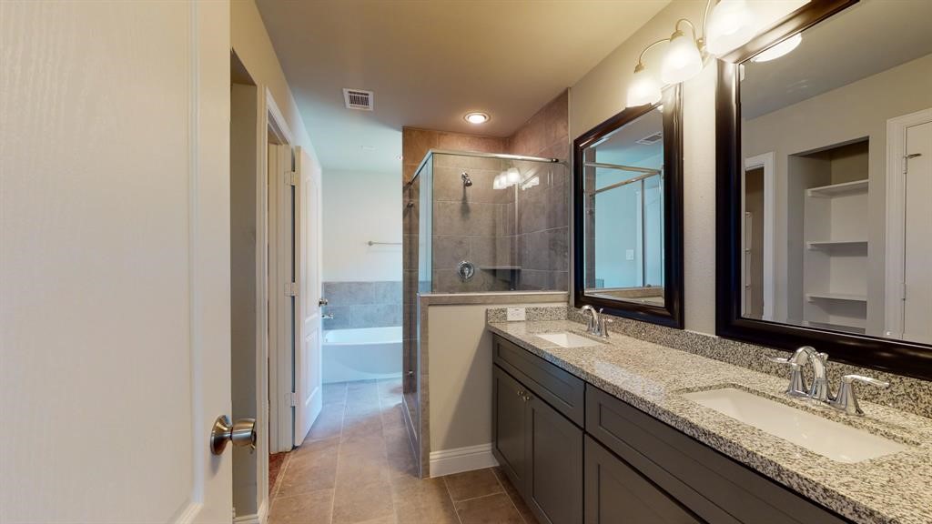 311 Mascot Street Houston, TX 77029 - Photo 18 of 23 a bathroom with a granite countertop sink mirror and double