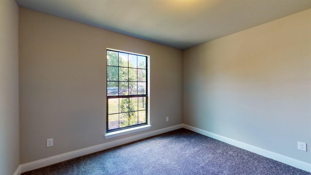 311 Mascot Street Houston, TX 77029 - Photo 7 of 23 an empty room with a window