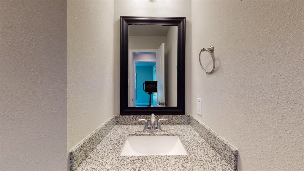 311 Mascot Street Houston, TX 77029 - Photo 9 of 23 a bathroom with a sink and a mirror