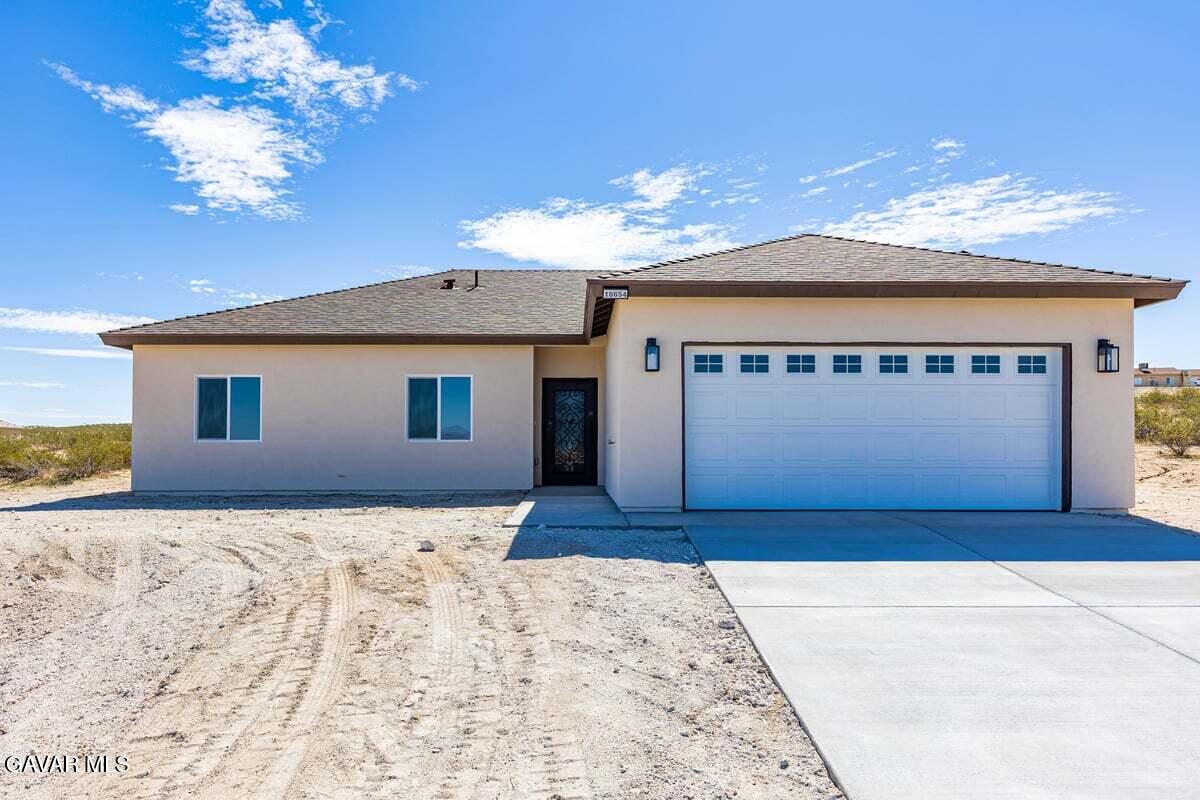 10654 Wilson Road California City, CA 93505 - Photo 1 of 36 a view of a house with a snow in the yard