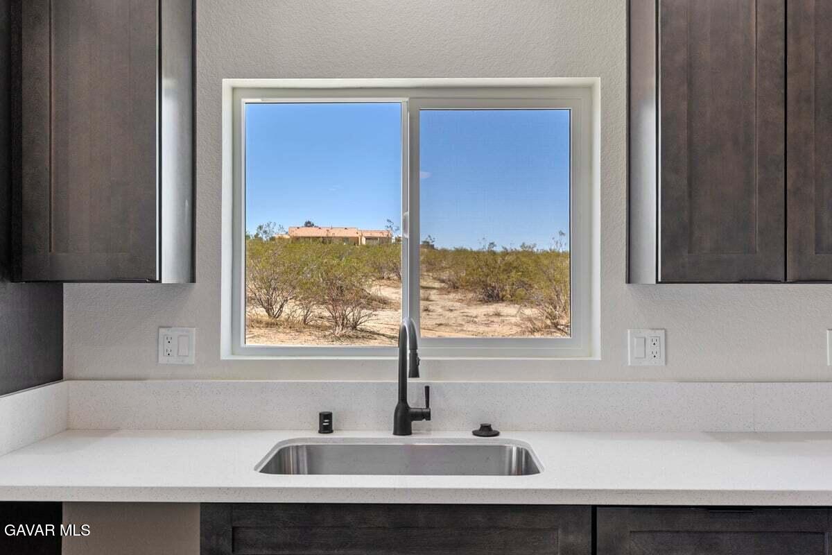 10654 Wilson Road California City, CA 93505 - Photo 11 of 36 a bathroom with a sink and a window