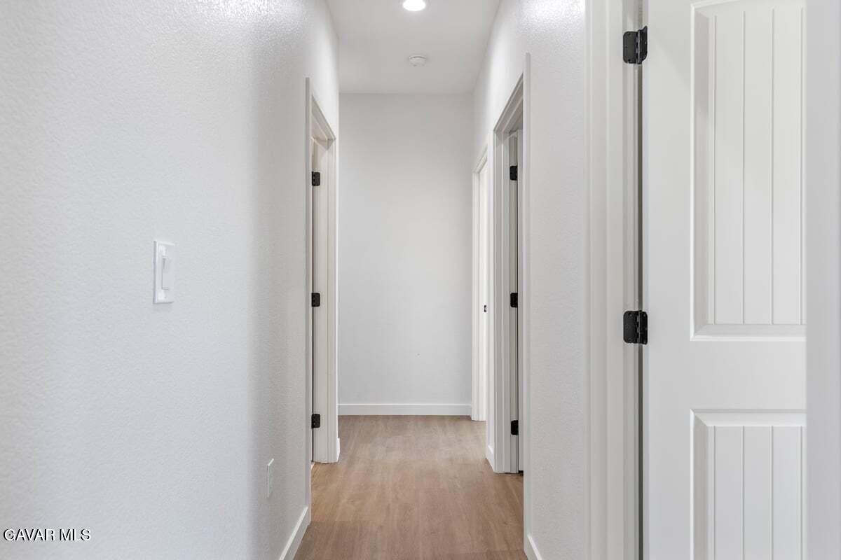 10654 Wilson Road California City, CA 93505 - Photo 15 of 36 a view of a hallway with wooden floor