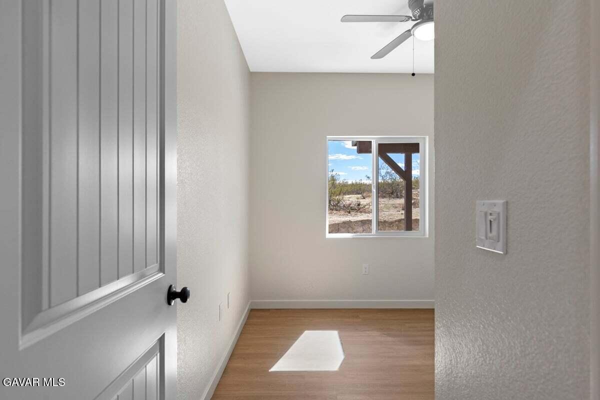 10654 Wilson Road California City, CA 93505 - Photo 16 of 36 a view of an empty room with a window