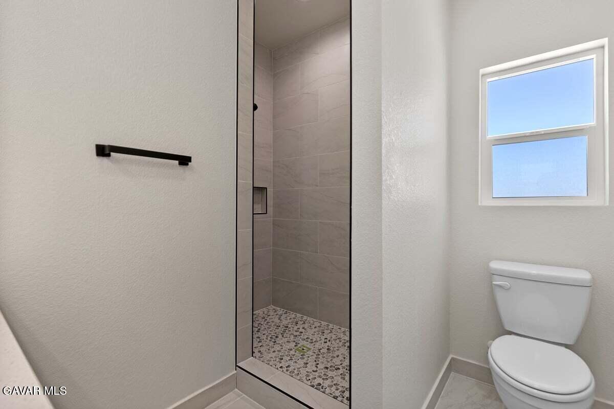 10654 Wilson Road California City, CA 93505 - Photo 22 of 36 a bathroom with a toilet